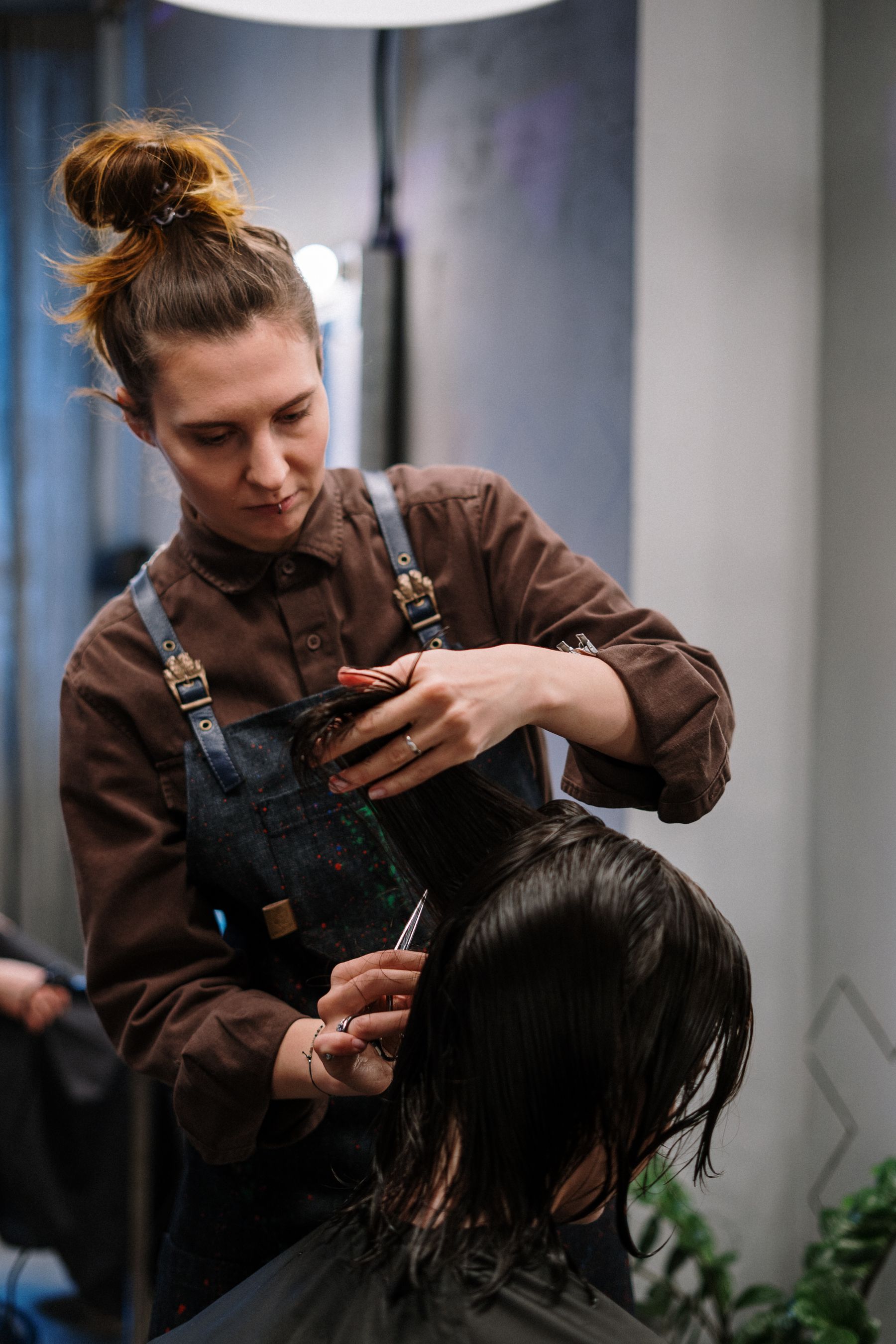 Stylist working on a client's hair in the salon